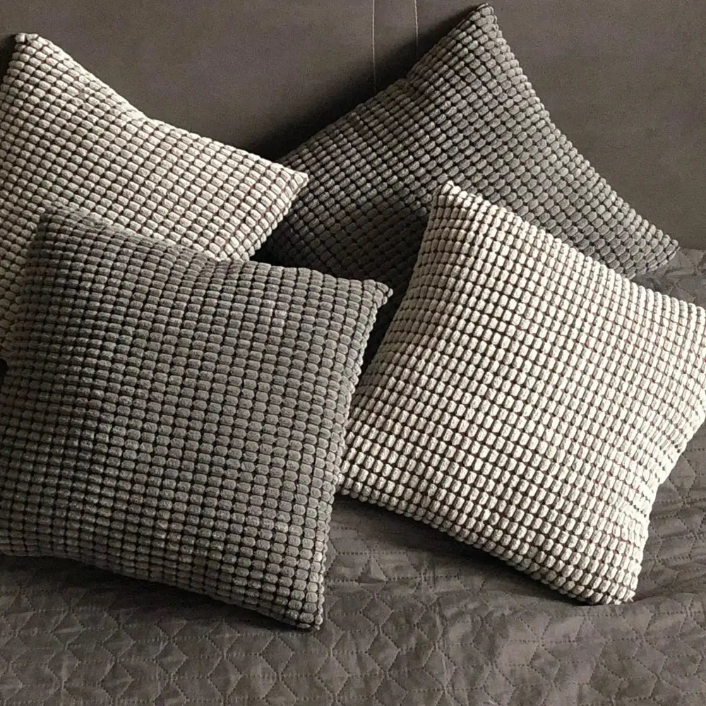 Four square gray textured corn grain cushion covers with raised grid pattern from decorbites corduroy corn collection