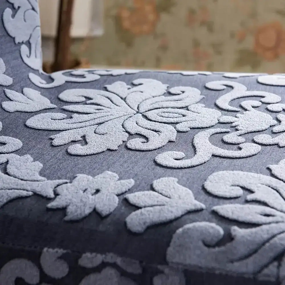 Gray upholstered chair with raised silver floral embossed print featuring decorbites 3d embossed chair covers for dining room