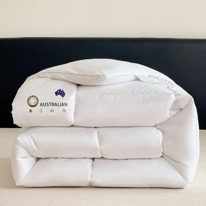 White australian down comforter with quilted panels and branded tag made from new zealand wool for four season bedding