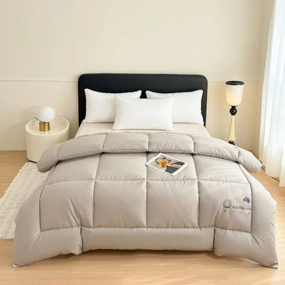 A soft light gray new zealand wool quilt with a subtle australian logo embroidered thick heating blanket