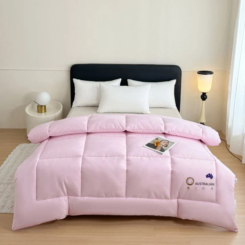 Pink quilted new zealand wool quilt with plush texture and subtle stitching for four season household bedding