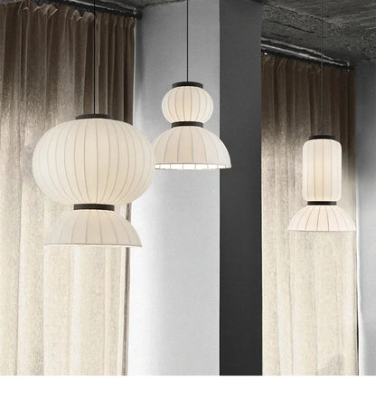 White ribbed paper lantern light pendant with black metal accents for dining room and shop hanging light decor