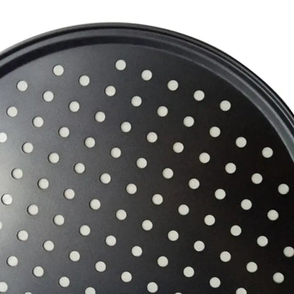 Black non stick carbon steel perforated pizza pan with evenly spaced holes for efficient baking tray use by decorbites