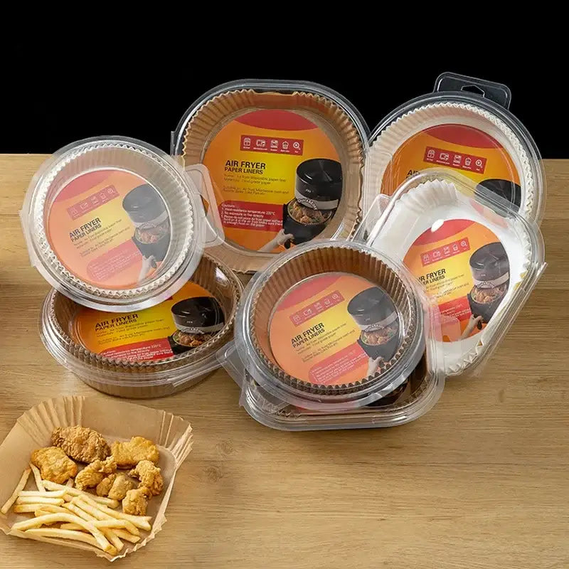 Clear plastic containers hold round fluted nonstick parchment paper liners for air fryer baking use