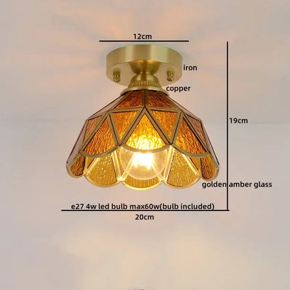 Vintage-style ceiling light with brass copper base and golden amber stained glass panels in geometric petal design