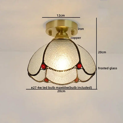 Vintage-style bedroom ceiling light with brass-finished copper base and frosted glass copper led shade with red accents