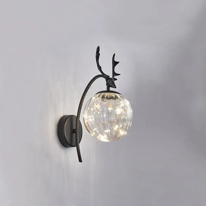 Black metal nordic ball wall mount sconce with antler design and textured clear glass globe housing warm led lights