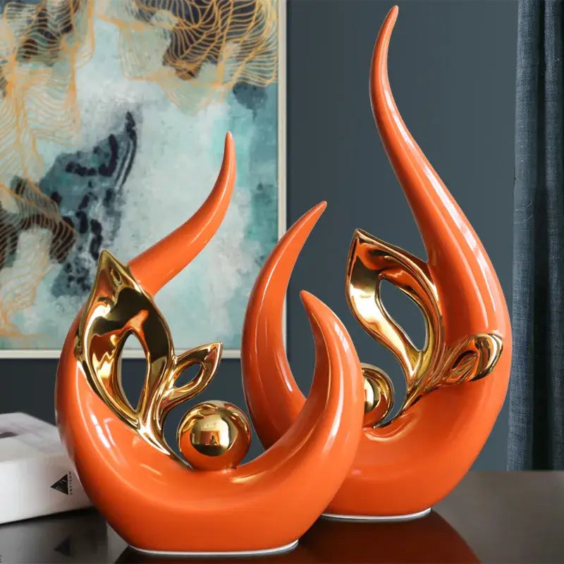 Vibrant orange nordic ceramic figurine with gold leaf accents and polished metallic sphere for living room decor