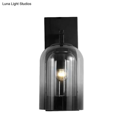 Nordic black wall lamp with matte finish and ribbed smoked glass dome shade housing an exposed bulb for bedroom use