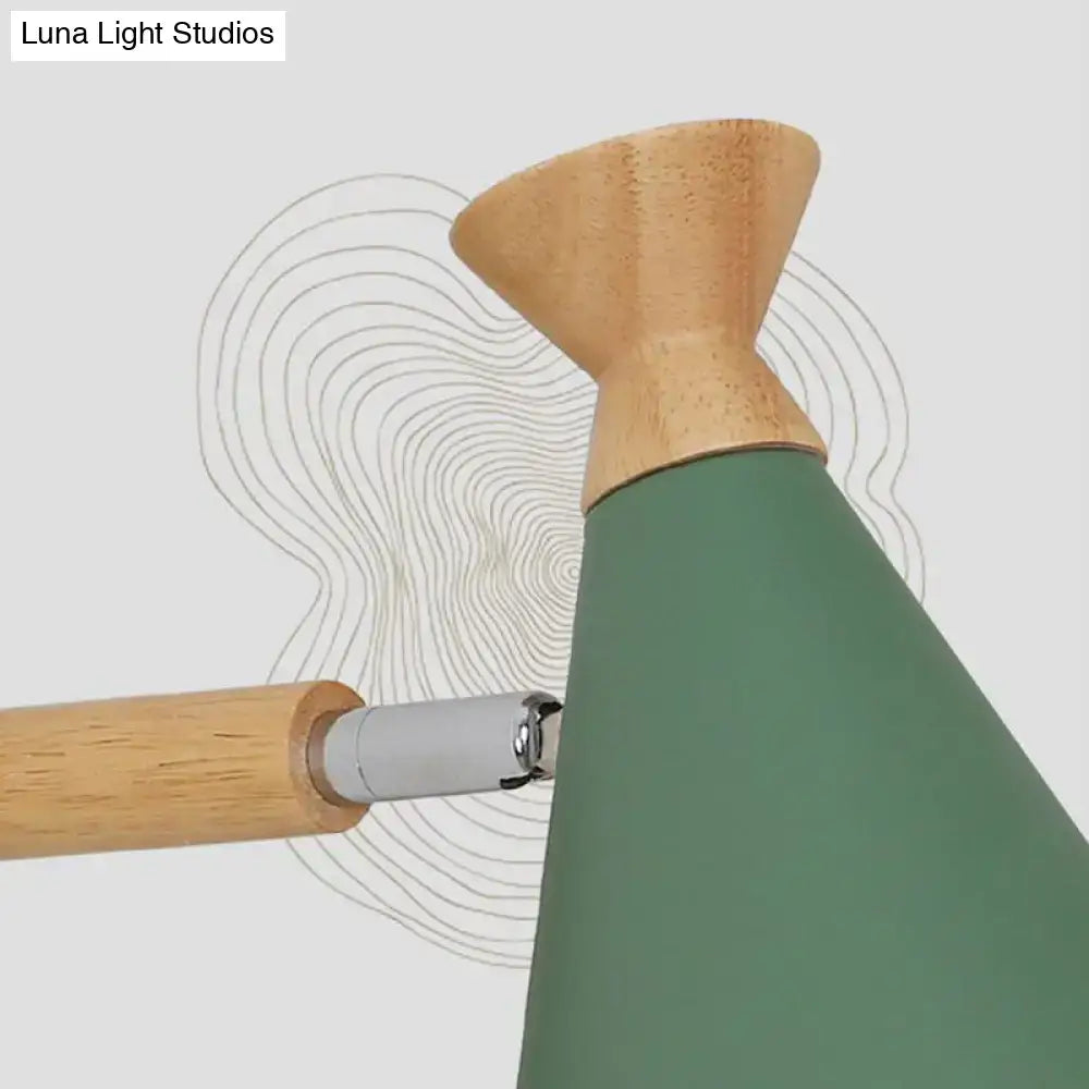 Modern floor lamp with matte green metal cone shade and light wood base complementing nordic blue wall light design