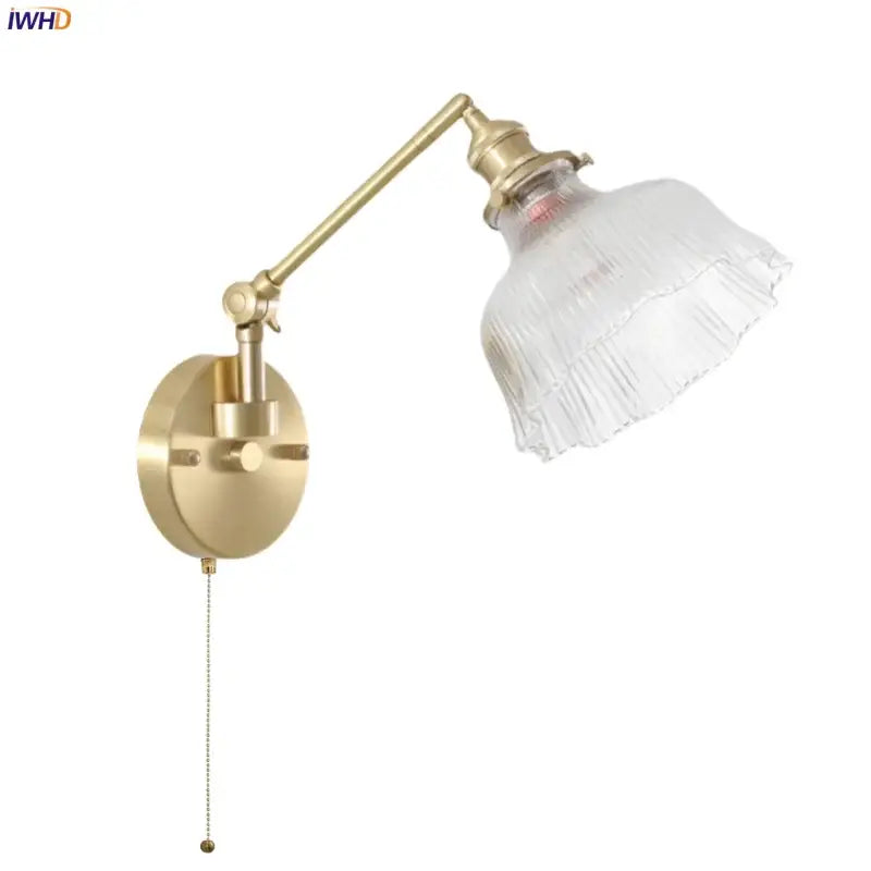 Brass-finished adjustable wall sconce with clear ribbed glass shade and bedroom pull chain decorbites clear glass design