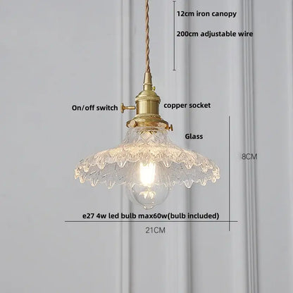 Vintage-style nordic pendant light fixture with brass-finished copper socket and ribbed clear glass shade for kitchen use