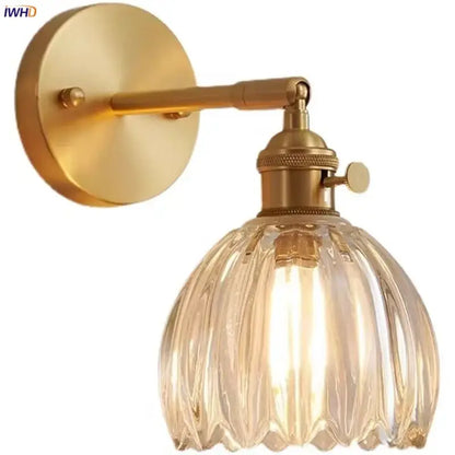 Brass-finished wall lights with faceted clear glass shade for bedroom decor featuring decorbites clear glass design