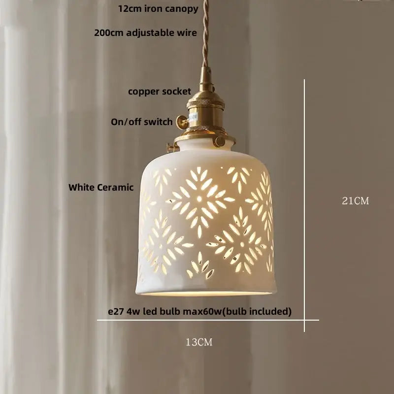 White ceramic pendant light with intricate leaf-patterned cutouts and brass copper socket for decorbites brown wood led dining room