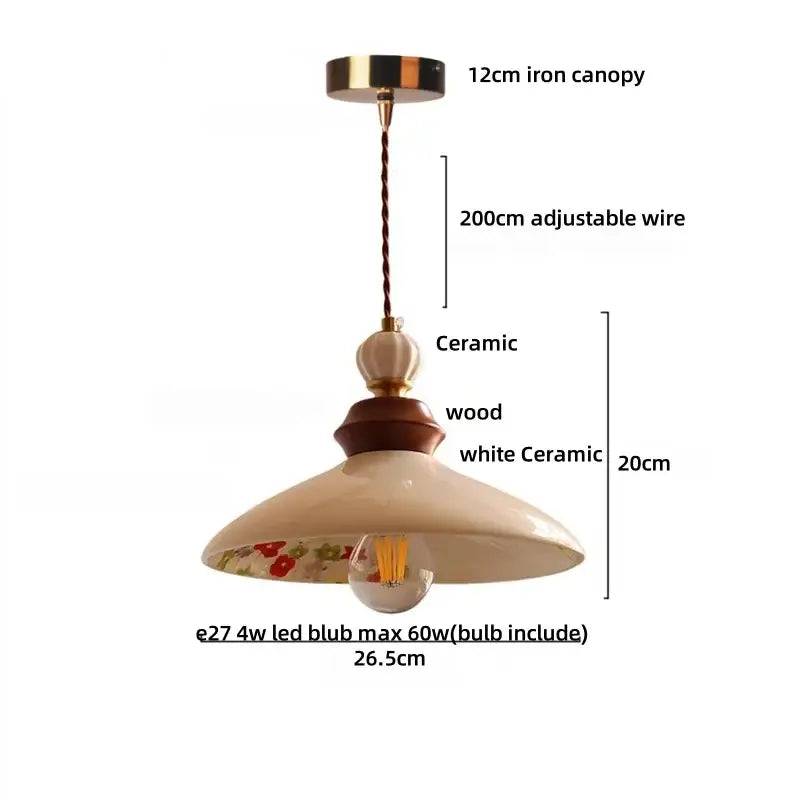 Cream-colored ceramic pendant light with floral interior, wooden accent ring, and brass fittings for dining room decorbites brown wood