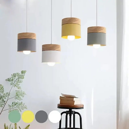 Modern cylindrical pendant lights with natural wood tops and colorful wood iron painted sections for living room decorbites decor