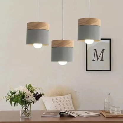 Three modern pendant lights with gray metal bodies and natural wood caps for living room decorbites colorful wood iron decor