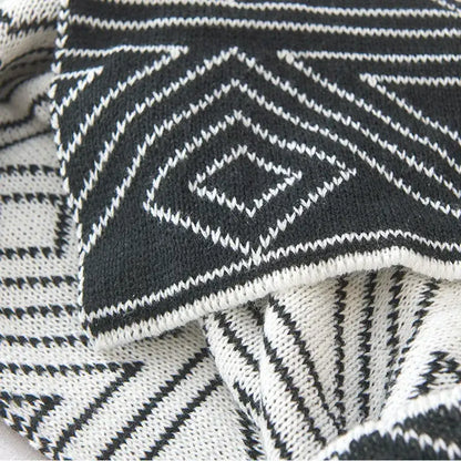 Black and white geometric-patterned grey knitted woolen blanket with textured interwoven design for living room decorbites grey knitted