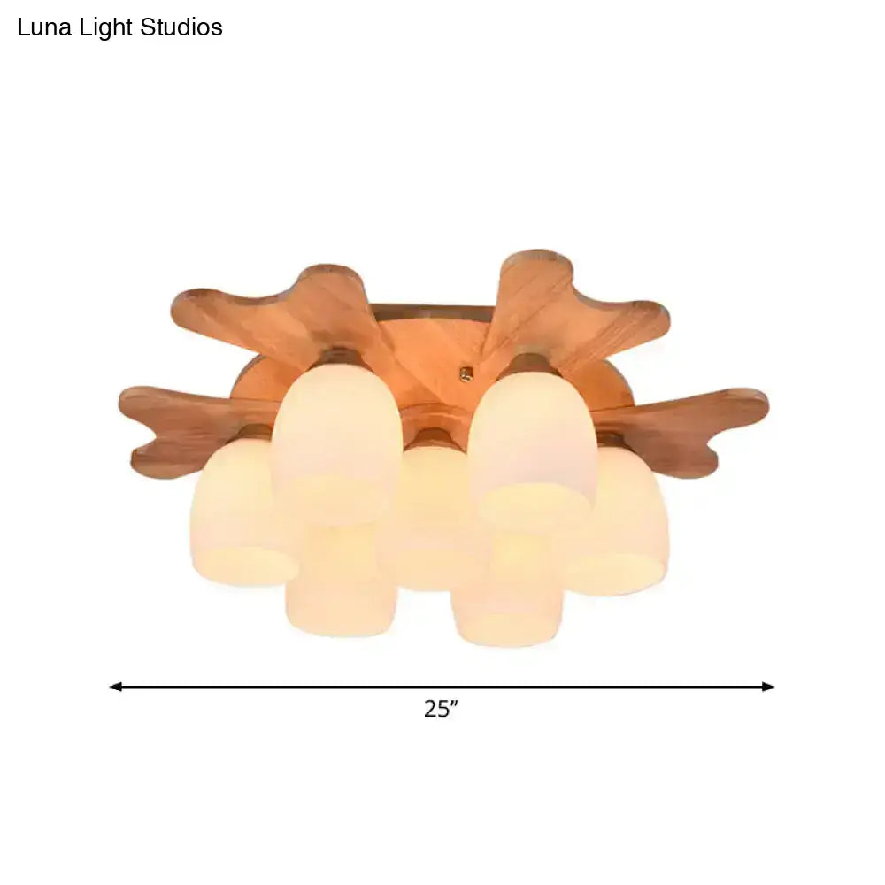 Nordic cream glass bell ceiling light with warm-toned wooden antler and five frosted glass shades for bedroom use