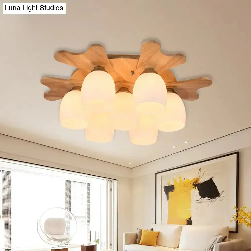 Nordic cream glass bell ceiling light with wooden antler and five frosted cream glass shades in natural wood finish