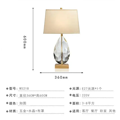 A sleek 60cm nordic crystal table lamp with a faceted crystal base and brass accents for bedroom use
