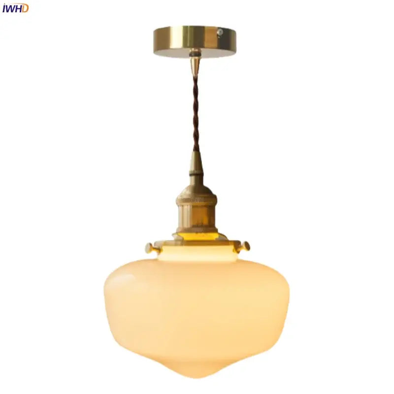 A nordic frosted glass led pendant lamp with brass metal fixture and twisted cord ideal for bedroom lighting