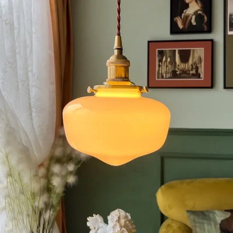 Warm amber glass led pendant lamp with brass hardware and twisted cord for nordic bedroom lighting