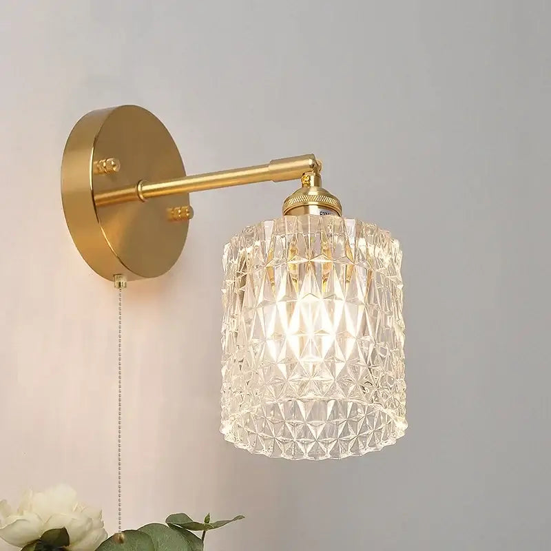 Gold-toned nordic brass led wall sconce with faceted crystal glass shade and adjustable arm for bedroom decorbites brass led wall
