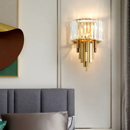 Gold-toned nordic crystal wall sconce with vertical rods and circular frame for living room decorbites crystal wall lighting