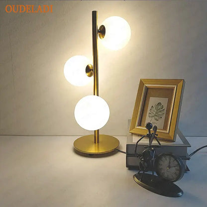 Nordic gold decorbites glass ball led table lamp with three frosted glass globes on a slender metallic stem for bedroom