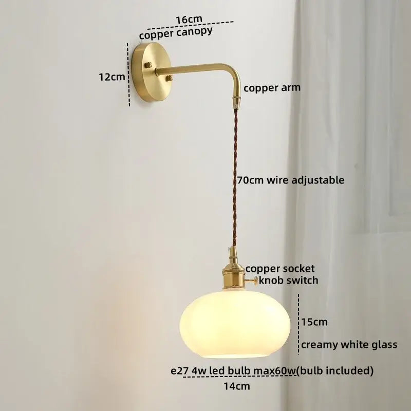 Vintage-style copper wall sconce lamp with braided cord and creamy white glass globe for bedroom lighting