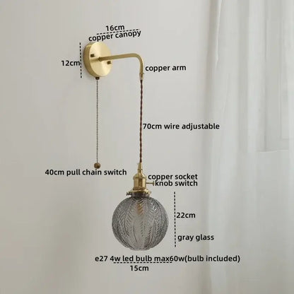 Nordic gold etched glass wall sconce lamp with brass copper arm and textured gray globe with adjustable braided cord