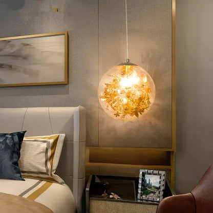 Nordic gold floral glass led pendant lamp with dried flowers inside suspended by a thin cord for kitchen lighting