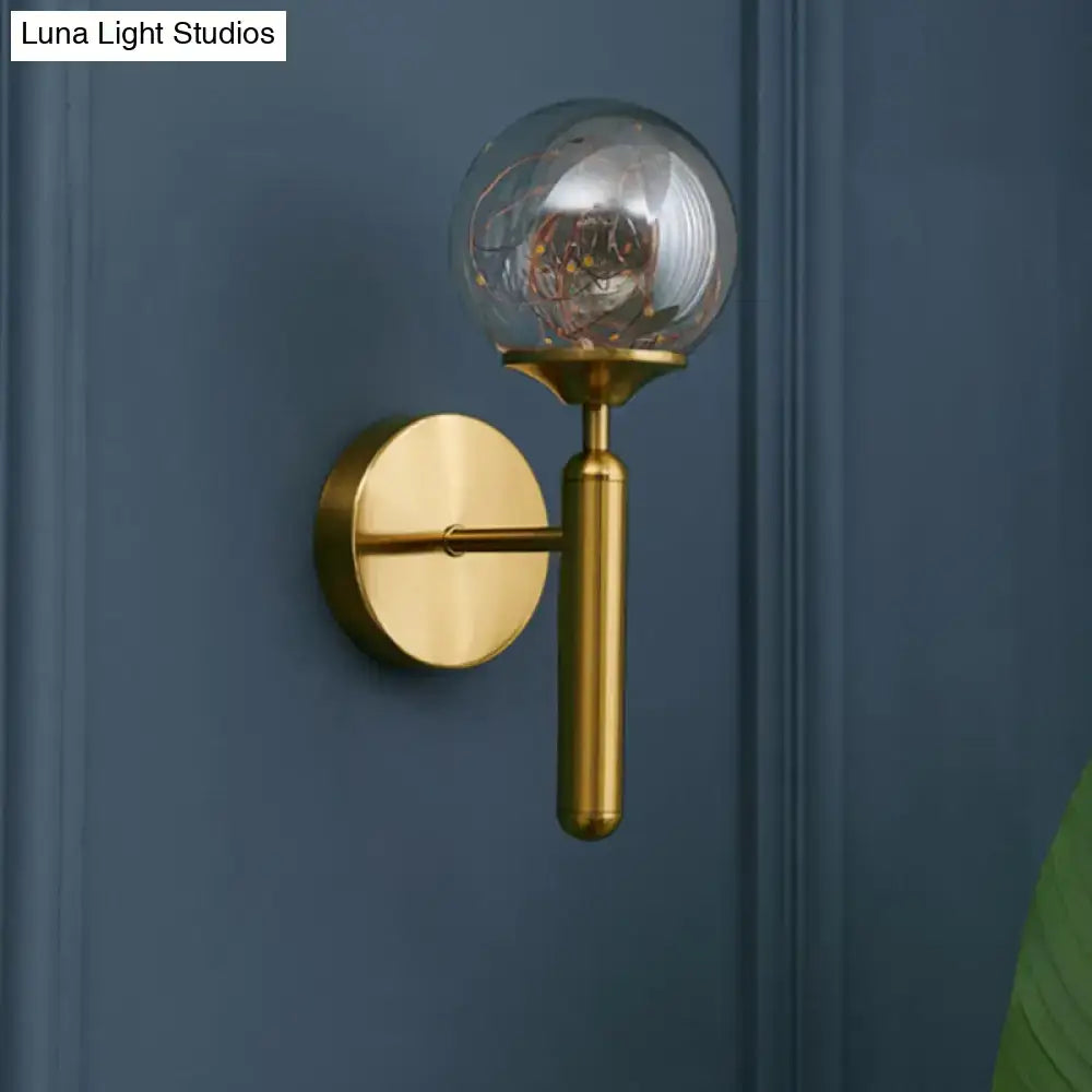 Nordic gold wall sconce with clear glass globe and exposed filament bulb for bedroom fairy light decor