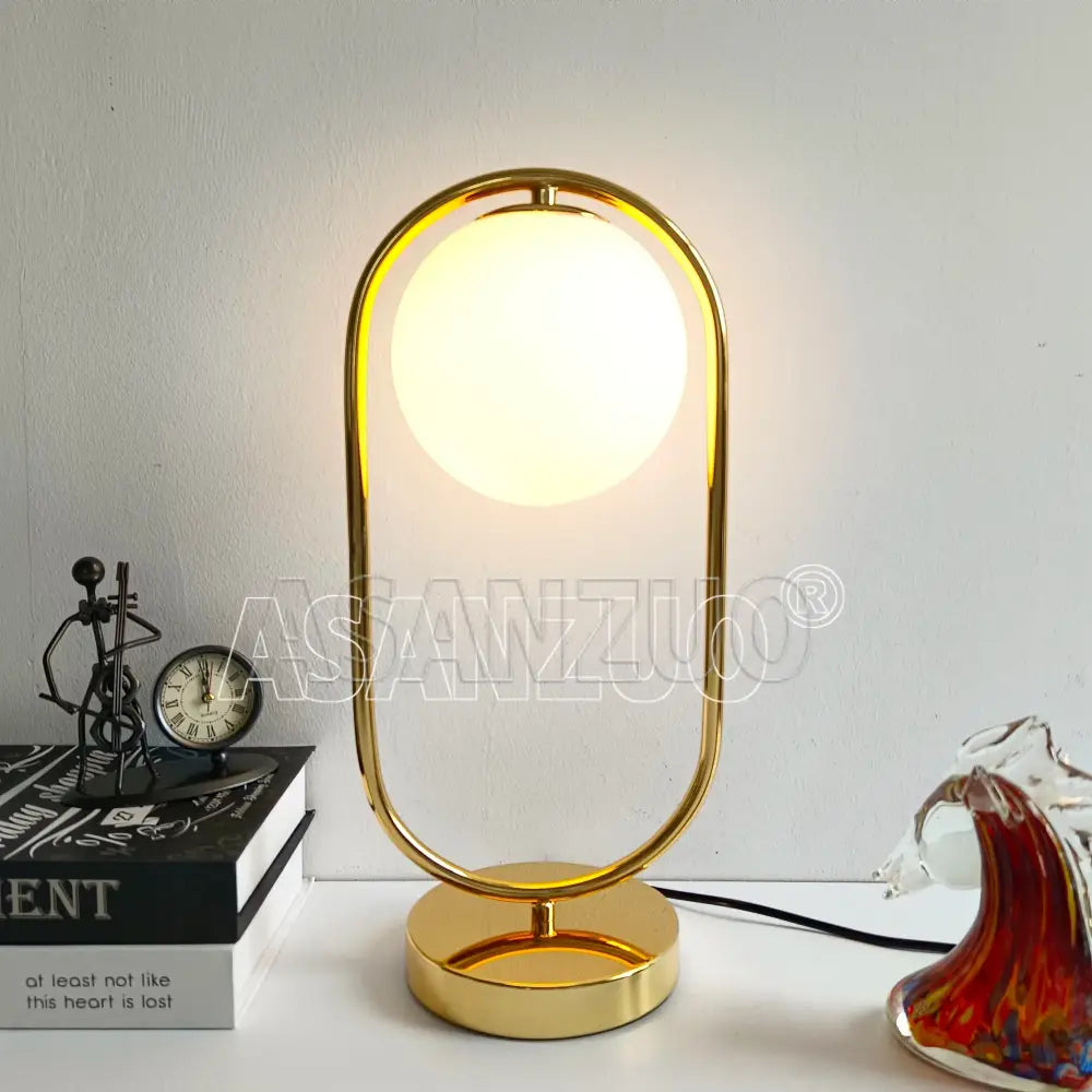 Nordic gold oval glass ball led desk lamp with frosted glass globe and sleek oval frame for bedroom decorbites glass ball