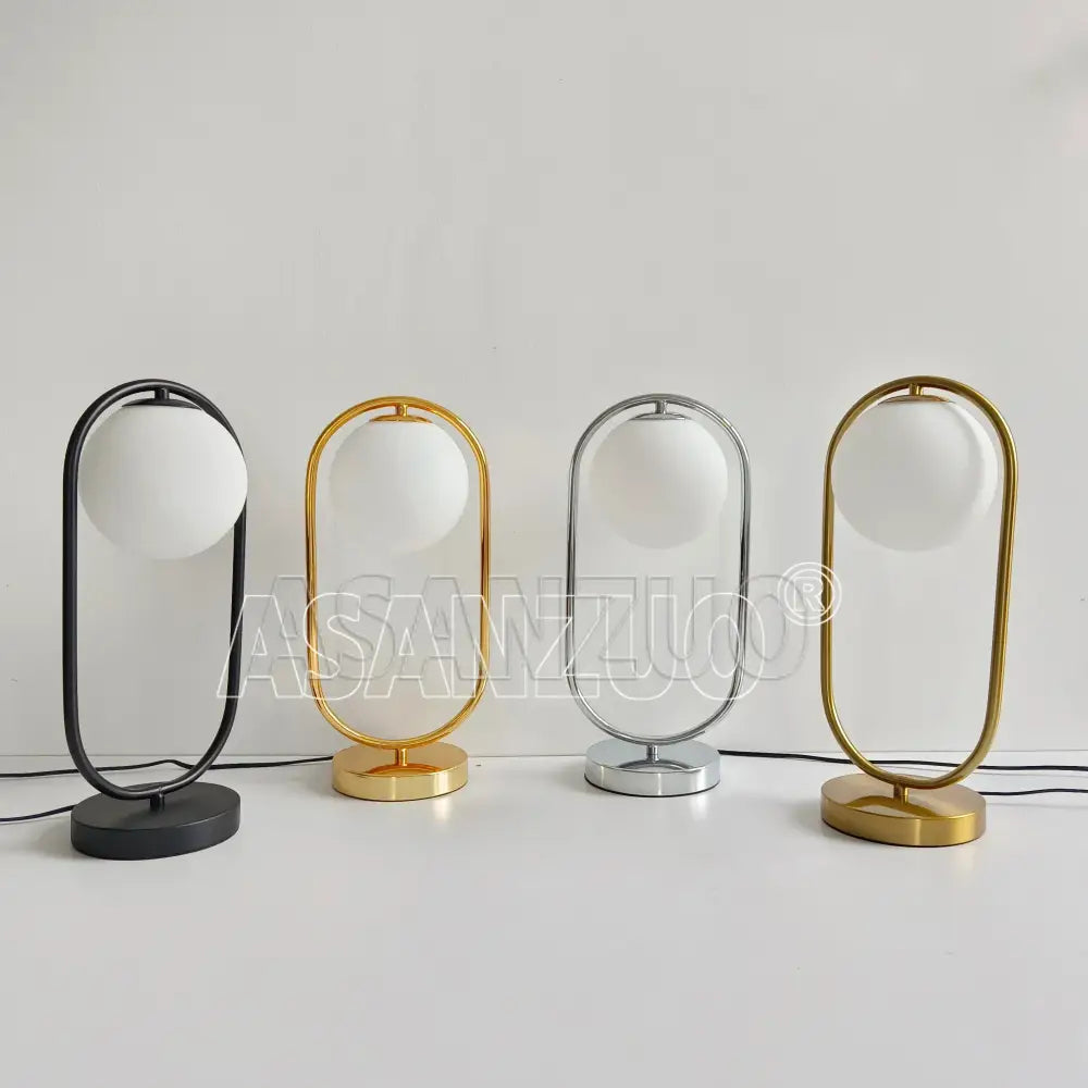 Modern nordic gold oval glass ball led desk lamp with sleek metallic frame in black gold silver and brass for bedroom decorbites glass ball