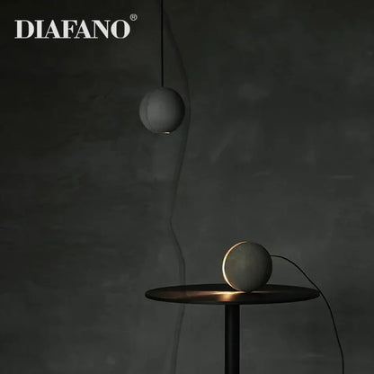 Diafano matte gray cement pendant light and table lamps with a spherical shape for nordic dining room decorbites cement pendant