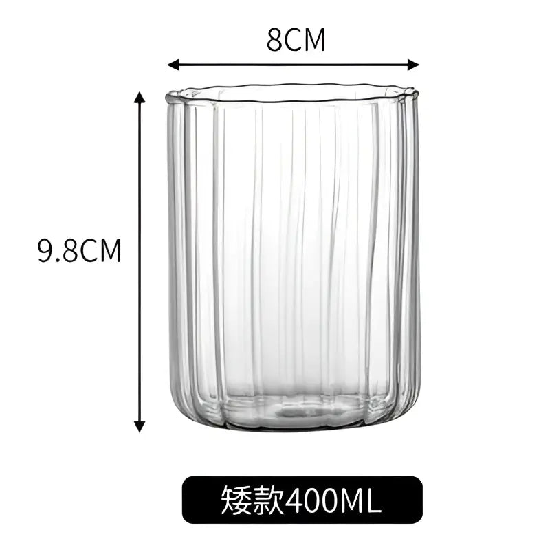 Clear glass ripple cup with vertical ribbed texture and flared rim in nordic design for dining room use
