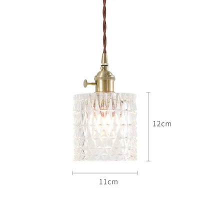 Clear faceted glass pendant lights with brass fixture and twisted brown cord in nordic japan style for dining room