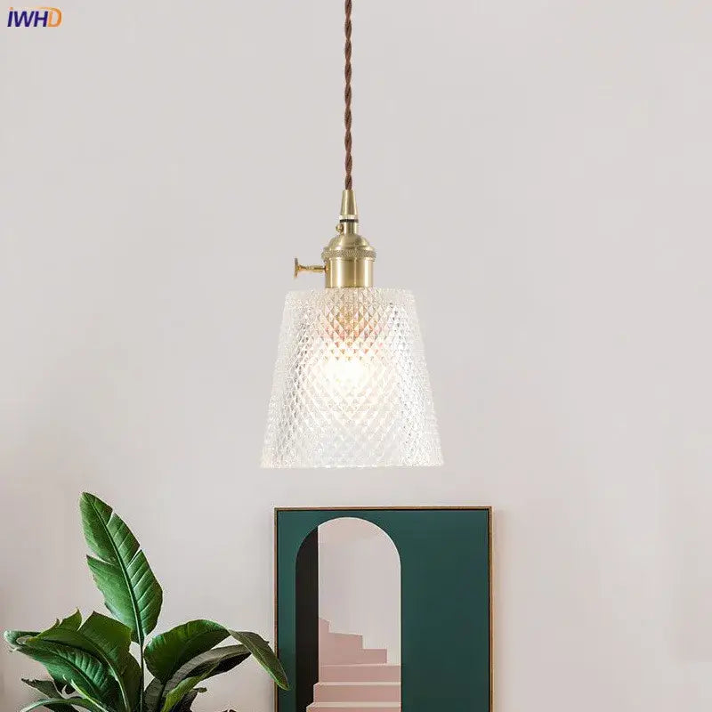 Nordic japan style pendant lights with brass-finished metal and clear textured glass shade for dining room use