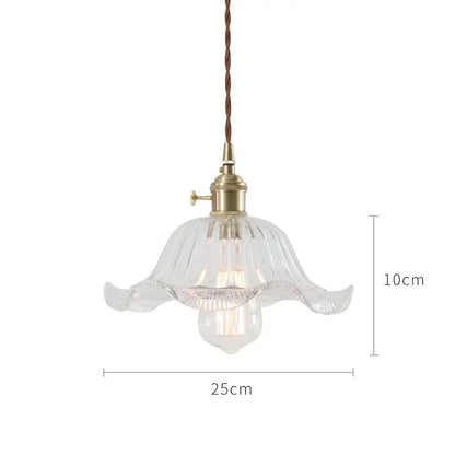 Clear glass pendant light with fluted petal design and brass hardware for nordic japan style dining room lighting