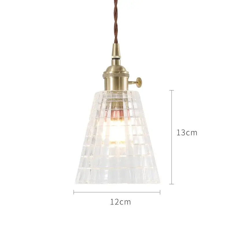 Clear glass pendant lights with brass-finished socket and twisted brown cord in nordic japan style for dining room