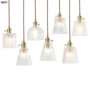 Nordic Japan style glass pendant lights with clear textured faceted shades and brass fixtures for dining room lighting