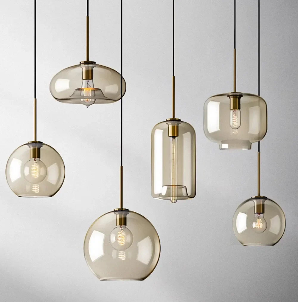 Set of modern nordic led glass pendant lights with smoked glass brass accents for dining room and living spaces