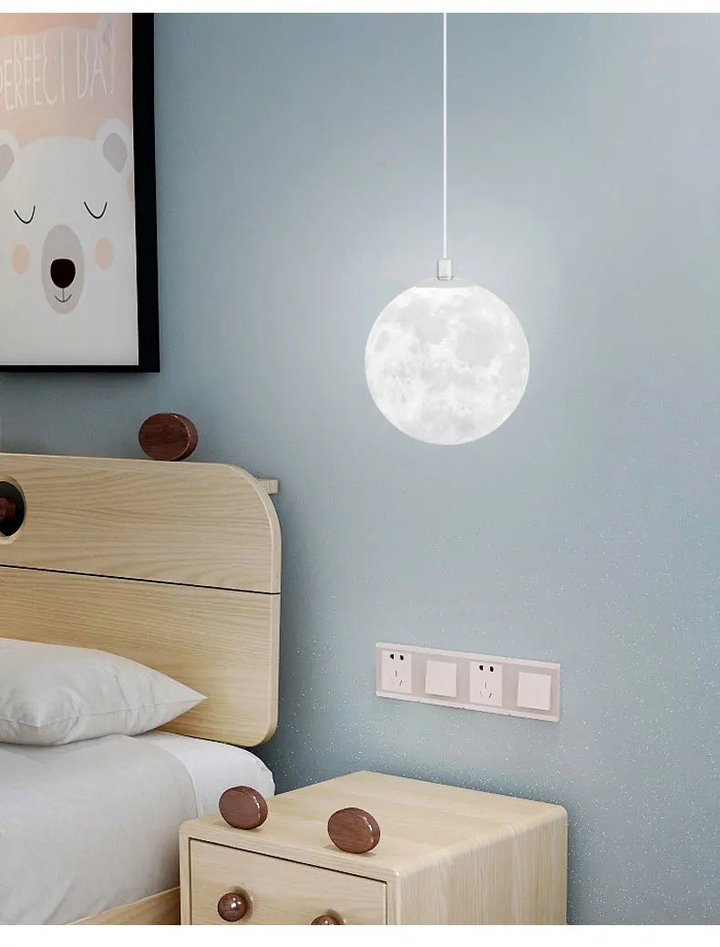 A white spherical led moon pendant light with detailed surface design for dining room kitchen decor hanging lamp