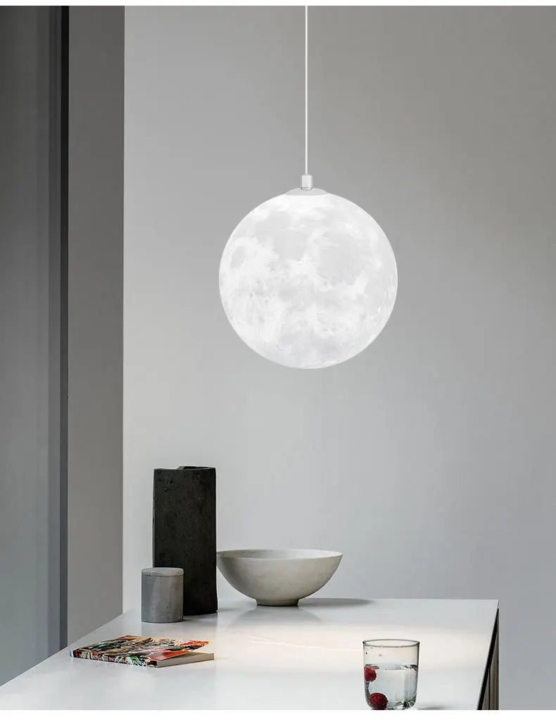 White spherical nordic led moon pendant chandelier with detailed lunar design for dining room kitchen lighting