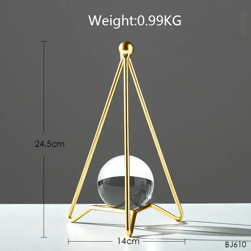 Nordic light luxury gold crystal ball crafts featuring a gold-toned triangular metal stand with clear glass sphere