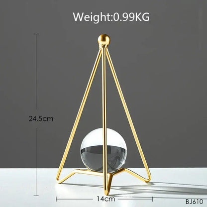 Nordic light luxury gold crystal ball crafts featuring a gold-toned triangular metal stand with clear glass sphere