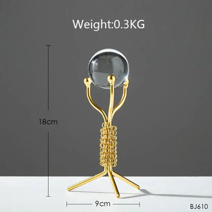 Nordic light luxury gold crystal ball crafts metal stand with clear glass sphere and intricate coiled three-legged base