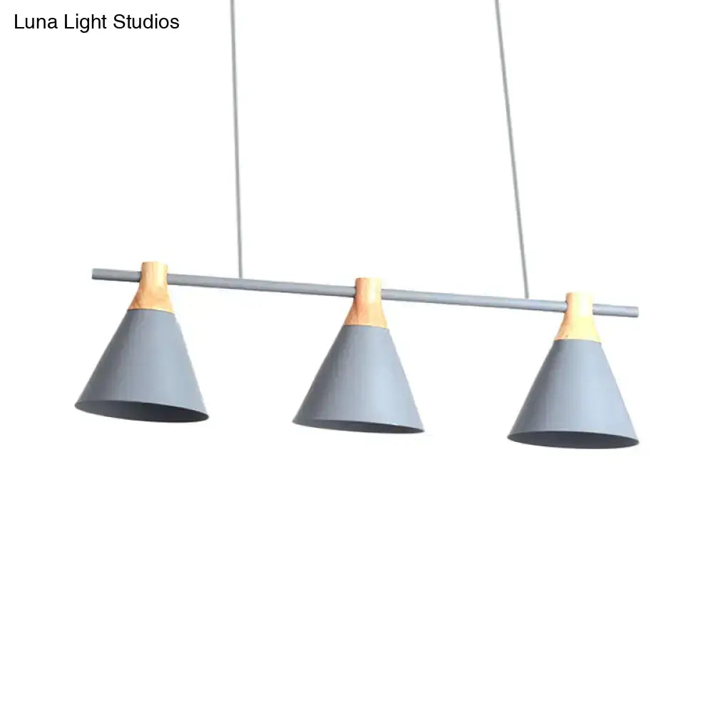 Modern gray and wood metal pendant light fixture with three green conical shades for kitchen island lighting